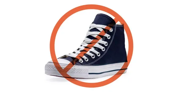 A chewed-up shoe, a classic example of a dangerous and destructive chew habit for puppies.