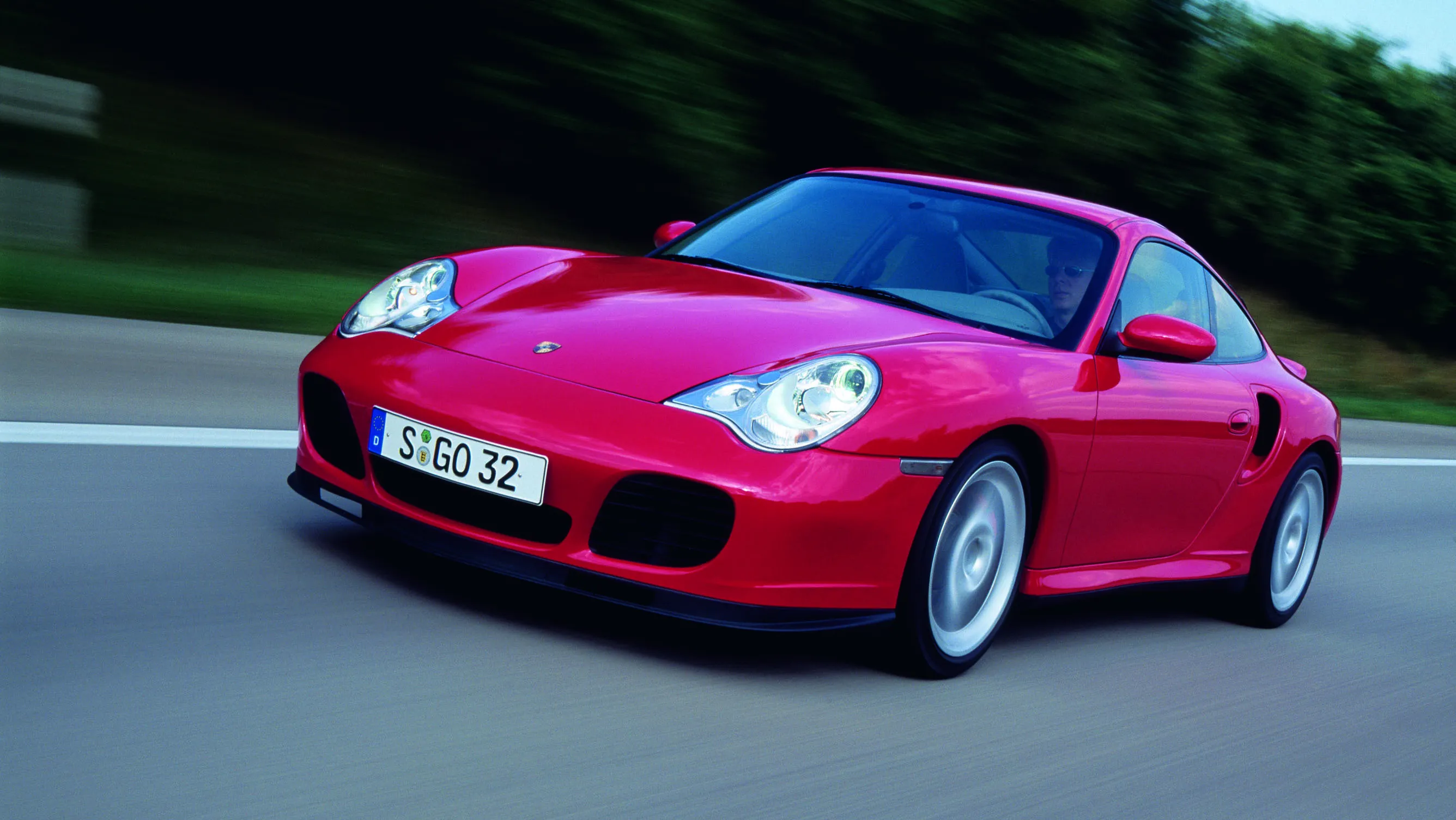 A classic 2002 Porsche 911 Turbo 996, highlighting its powerful 414 hp engine and all-wheel drive, a true budget supercar for under 0,000.