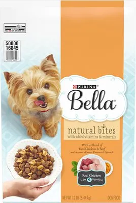 A dog happily eating from a bowl of wet dog food.