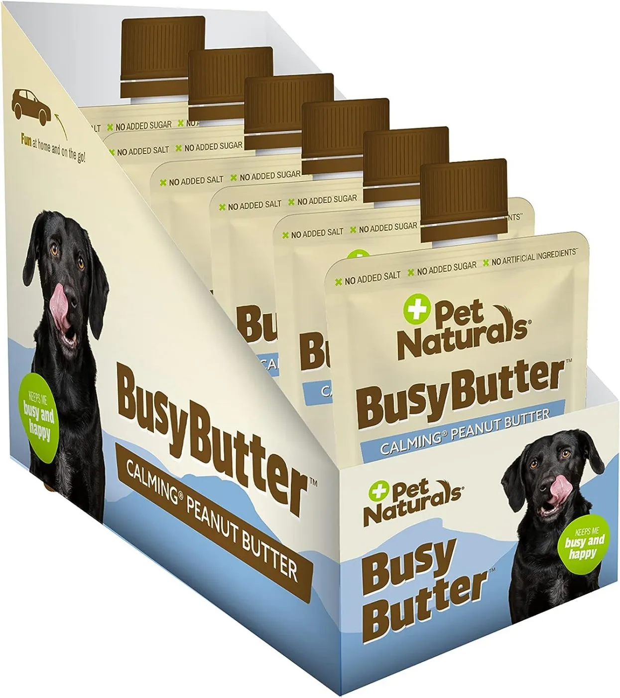 A dog looking eagerly at a squeeze pouch of busy butter
