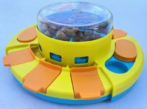 A dog puzzle toy against a white background.