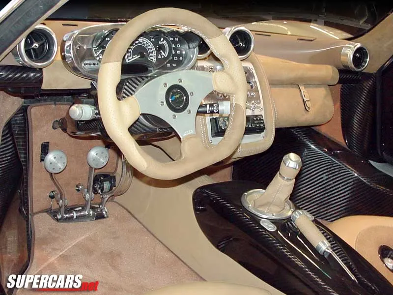A dynamic shot capturing the powerful and sleek lines of the 1999 Pagani Zonda C12-S in motion.
