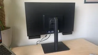 A graphic designer interacting with the Acer DS2 Series Pro monitor, demonstrating its intuitive 3D workflow for artists
