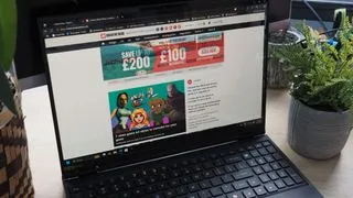 A laptop on a desk with its screen open