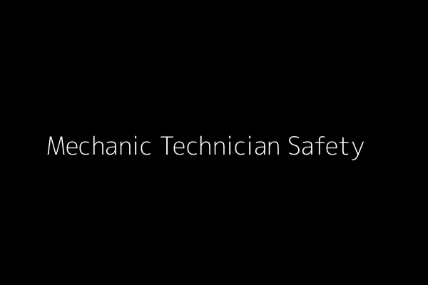 A mechanic technician wearing safety glasses and gloves while working on a machine