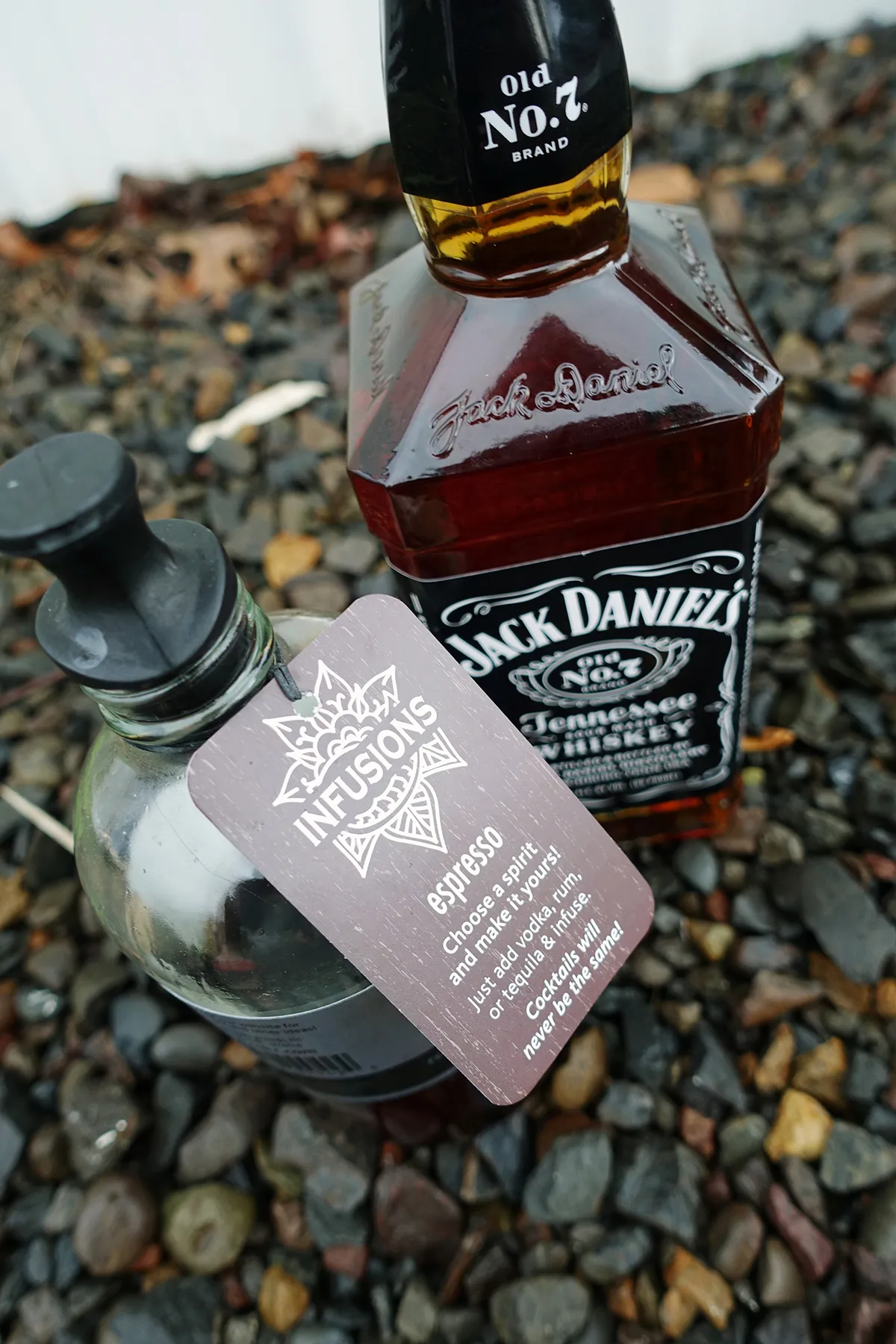 A rokz Espresso Infusion kit displayed with a bottle of Jack Daniel's Whiskey, showcasing the ingredients for "The Man in Black" cocktail.