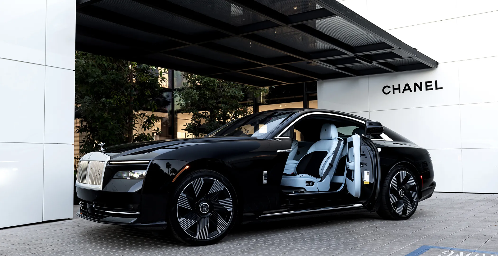 A sleek exotic car driving along a scenic coastal road, emphasizing the thrill of the rental experience
