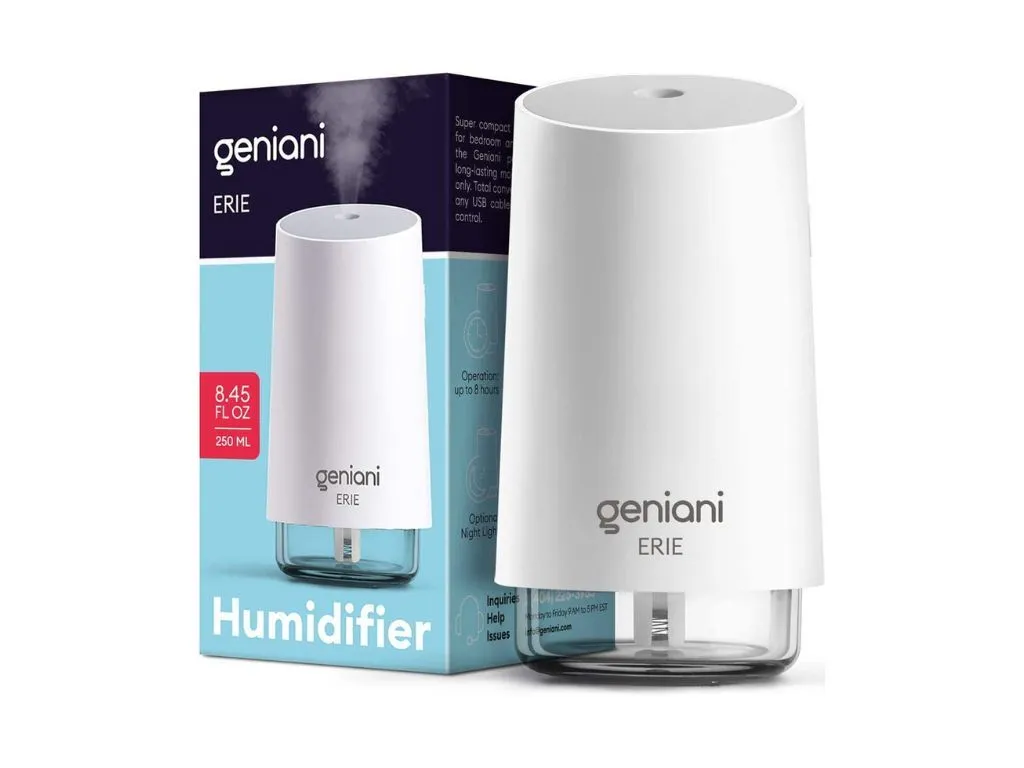 A small car humidifier placed in a car's cup holder.