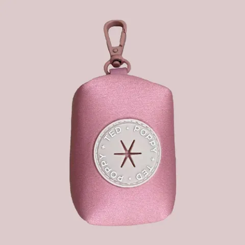 A stylish poop bag holder makes a practical accessory.