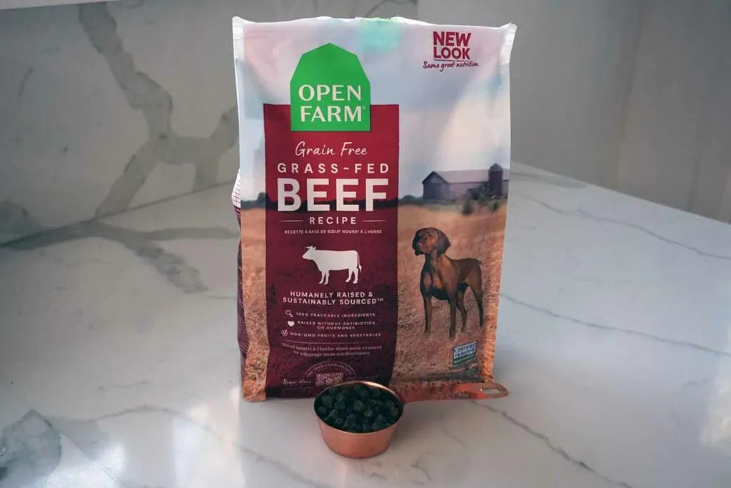 A variety of Open Farm dog food bags, illustrating their diverse product line.