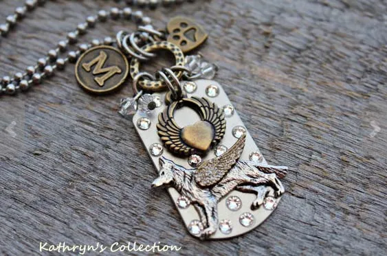 An angel charm bracelet with a German Shepherd initial