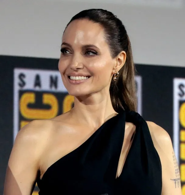 Angelina Jolie smiling - Angelina Jolie and Brad Pitt battle over their wine brand