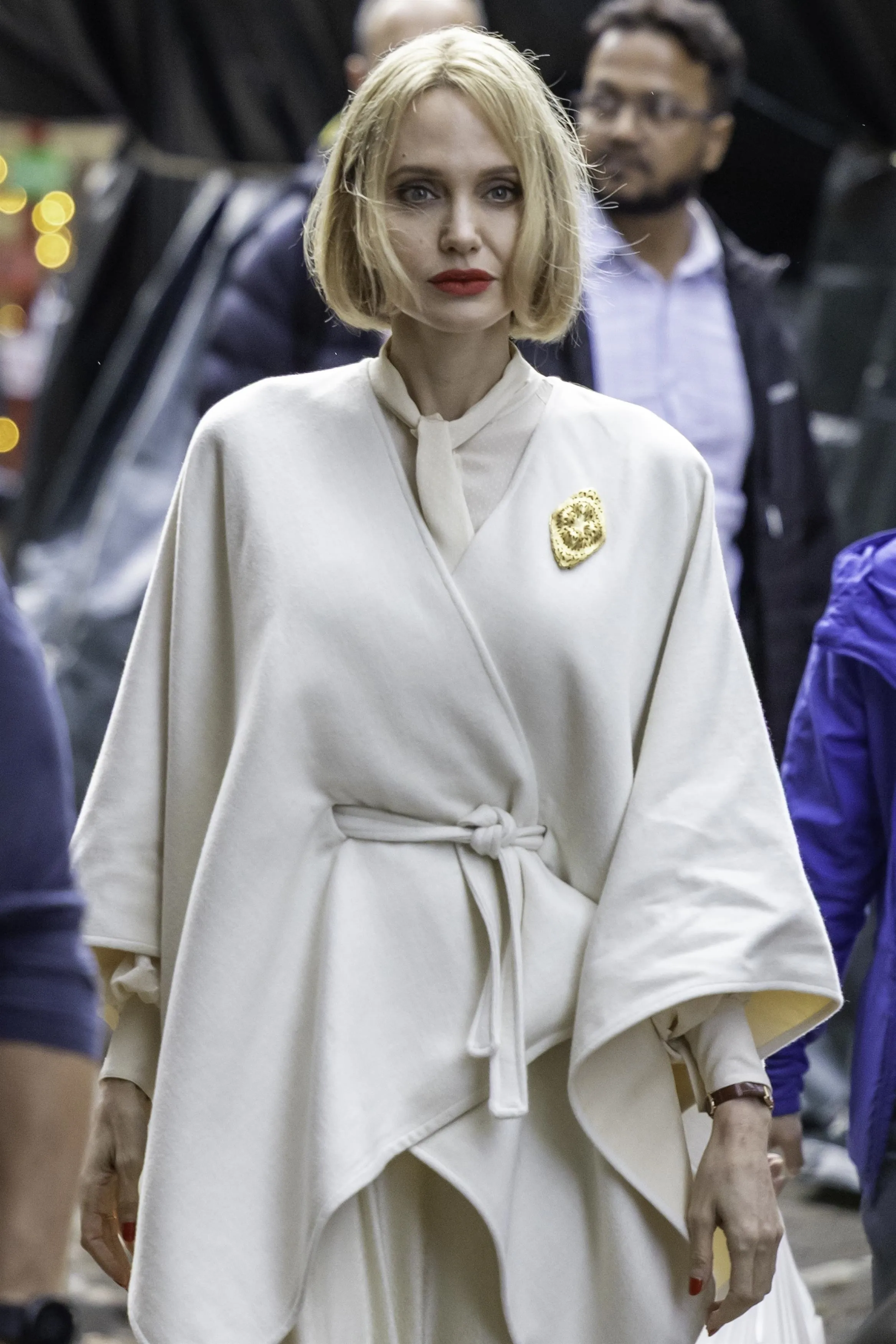 Angelina Jolie with red lipstick and nails