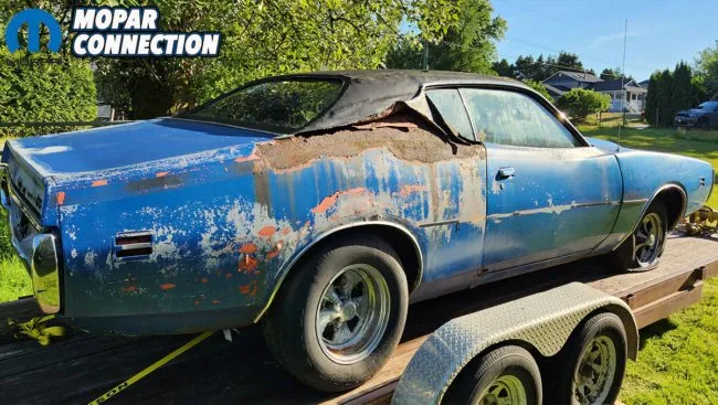 Another angle of the team carefully moving the classic Mopar