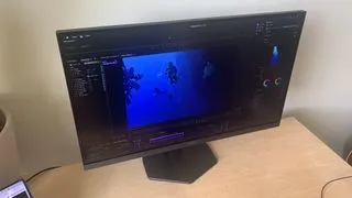AOC Gaming Q27G4ZR monitor from a side profile, emphasizing its ergonomic stand and clean lines