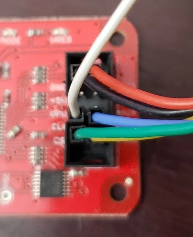 Assorted Bus Pirate cables, distinguishable by their unique colors, ready for connection to an embedded device's pins during a firmware dump