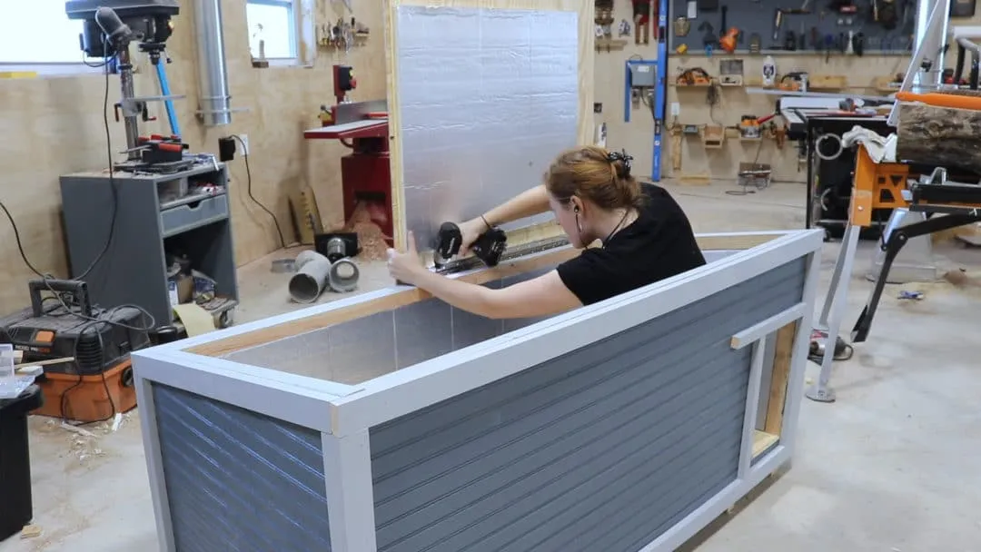 Attaching the hinged roof panels