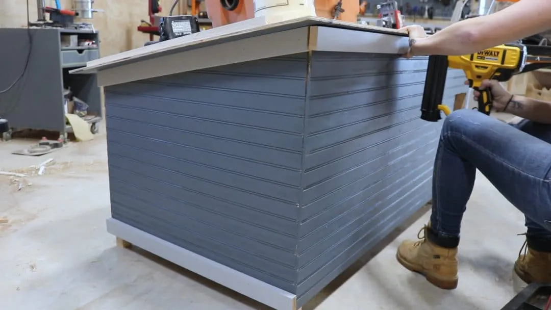 Attaching trim boards to the dog house