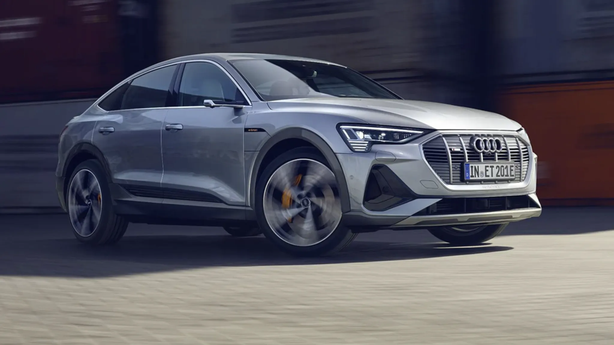 Audi e-tron electric luxury compact SUV in blue, front-side view