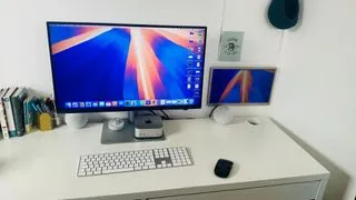 BenQ PD2730S monitor from a different angle, showing its sleek profile on a desk setup