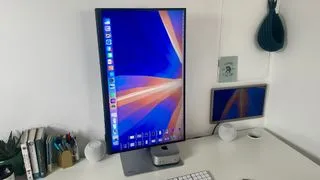 BenQ PD2730S monitor rotated into portrait mode, demonstrating its versatility for vertical content creation