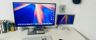 BenQ PD2730S monitor showcasing its side profile, emphasizing the thin bezels and adjustable stand