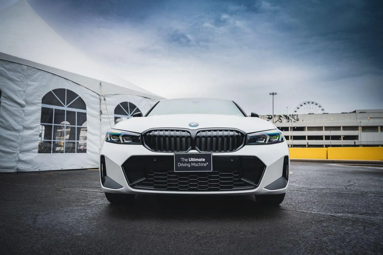 BMW 330e in motion showcasing its dynamic chassis and handling, powered by its electric motor system