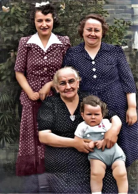 Bobby Zimmerman, who would become Bob Dylan, sits on the lap of his great-grandmother, Lybba Edelstein, in this photo taken in 1942.