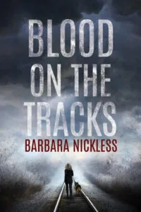 Book cover of Blood on the Tracks by Barbara Nickless, featuring a K9 dog with a railroad track in the background