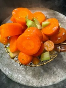 Bright orange carrots, a favorite and healthy treat for dogs, also beneficial for their teeth.