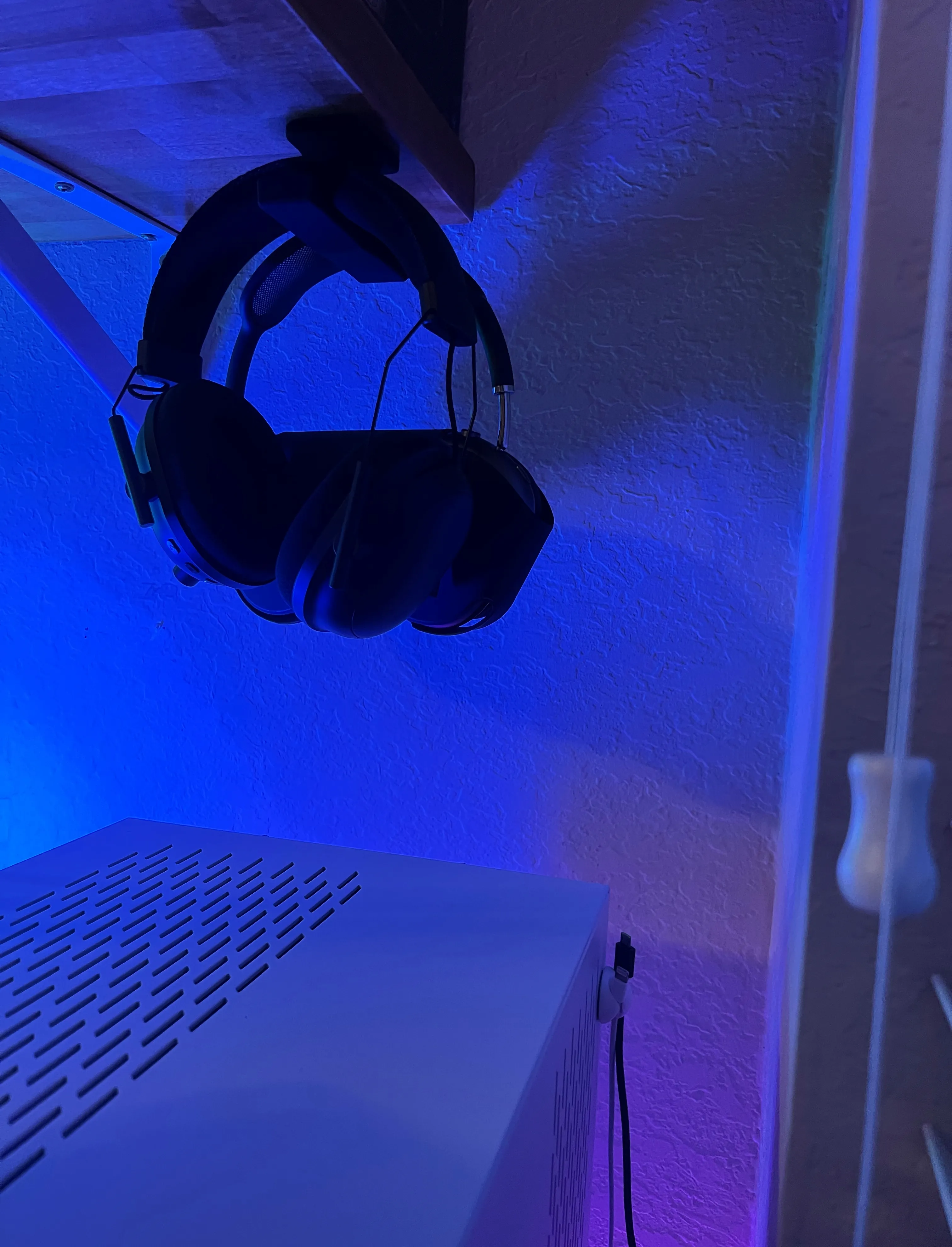 Cables behind PC for charging headphones