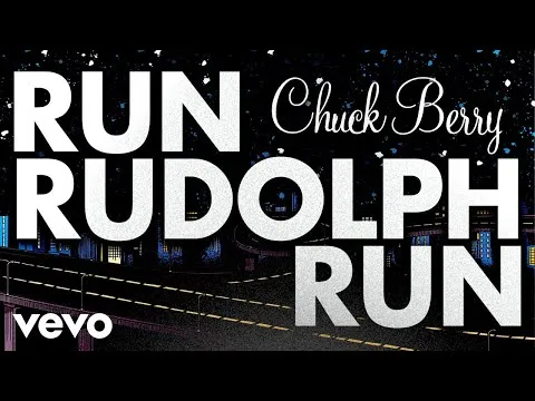 Chuck Berry performing "Run Rudolph Run" on stage