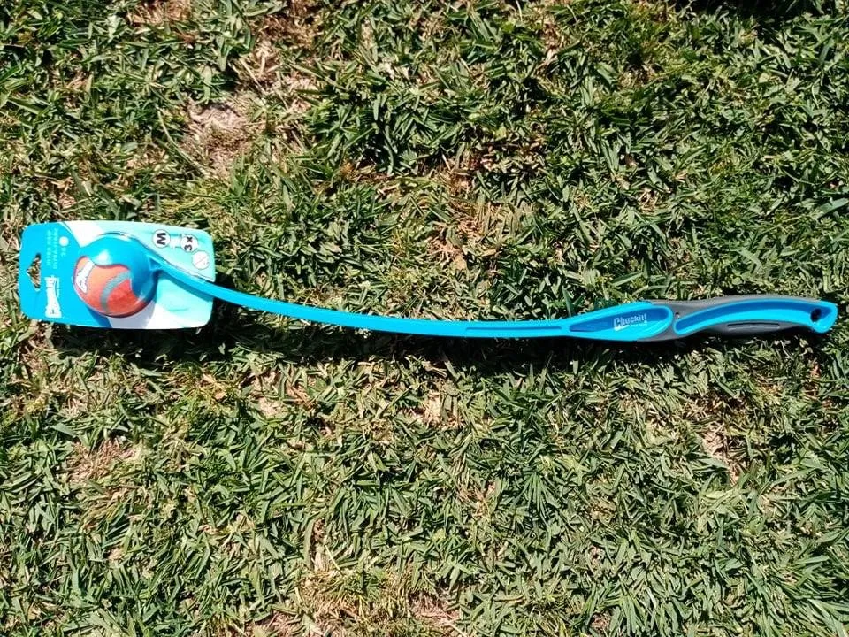 ChuckIt! Ultra Grip Dog Ball Launcher, blue, with a tennis ball