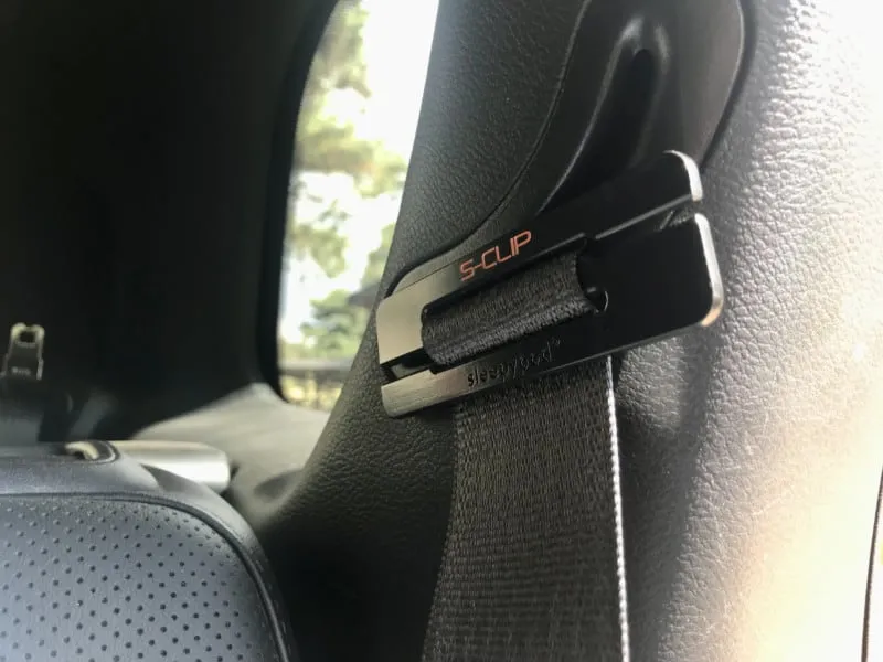 Close-up of a Sleepypod S-Clip, an accessory for securing the seat belt