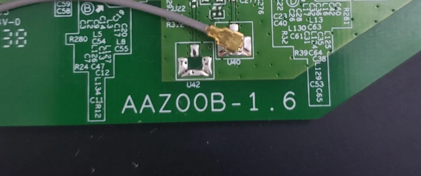 Close-up of the Belkin router's circuit board, clearly displaying the "AAZ" hardware ID, confirming successful firmware identification
