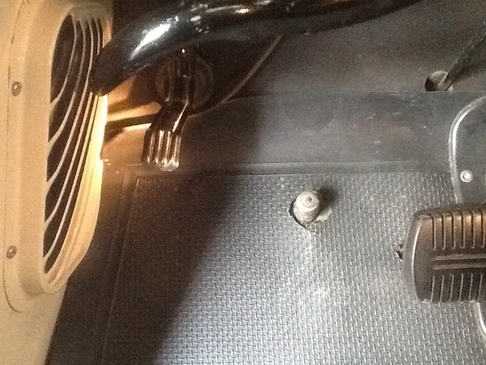 Close-up of the rare foot-operated windshield washer pedal in a vintage 1955 Chevy pickup
