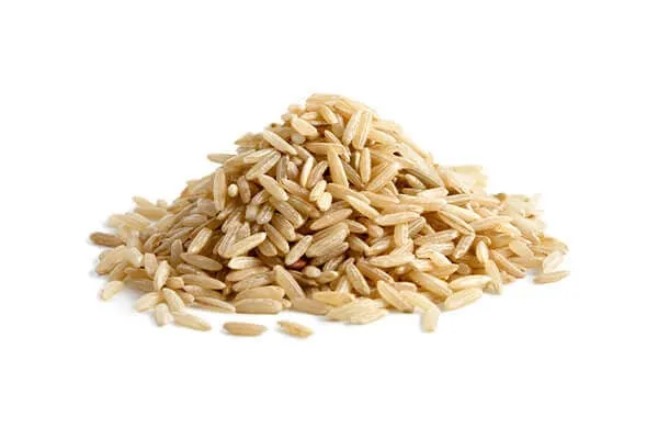Cooked brown rice, a natural whole grain providing essential B vitamins and fiber for senior dogs.