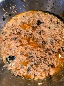 Cooked salmon, a lean protein source, carefully deboned for home cooked dog meals