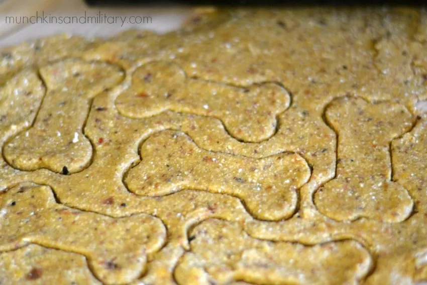 Cookie cutters shaping bacon dog treats dough