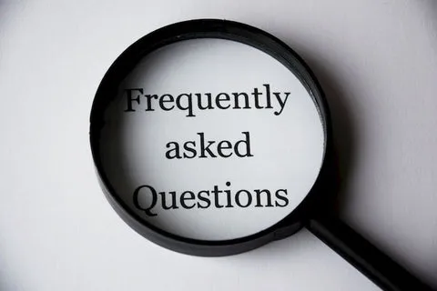 Curious dog looking at a pet supplement bottle, representing frequently asked questions about hemp for dogs