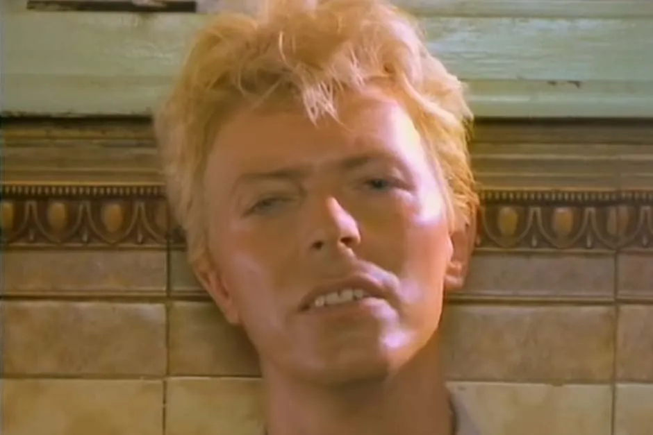 David Bowie performing, illustrating his evolving artistry