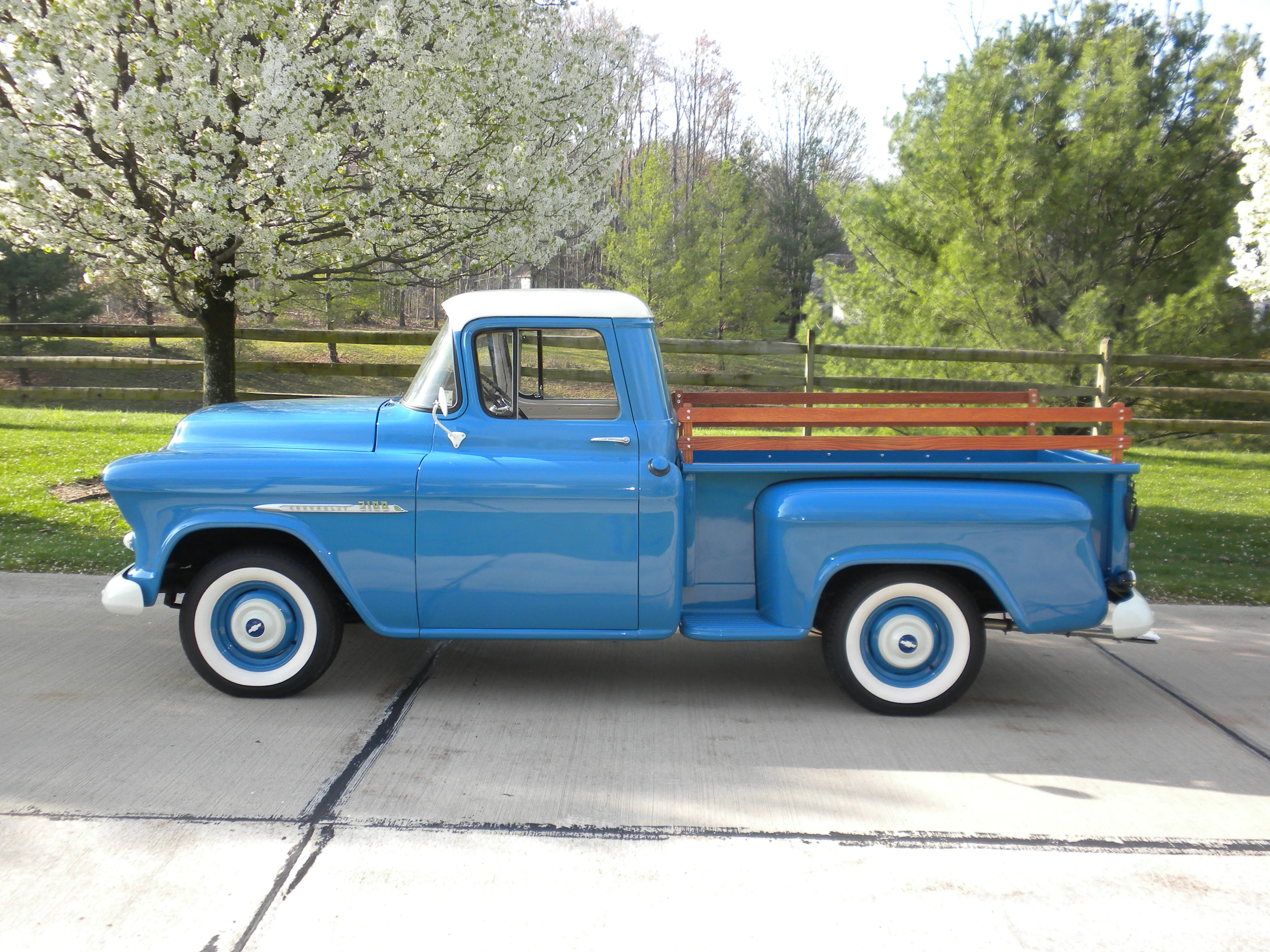Detailed view of the flawless paint and well-maintained exterior of a vintage 1955 Chevy pickup