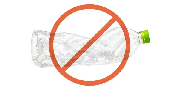 Discarded plastic water bottle, an unsafe item for dogs to chew on that can cause choking or blockages