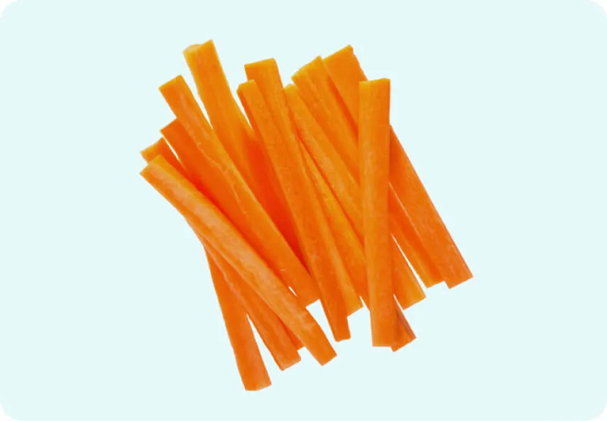 Dog enjoying a healthy carrot snack