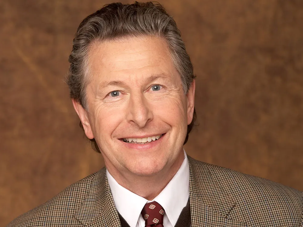 Dr. Nicholas Dodman, a veterinarian, smiling gently.