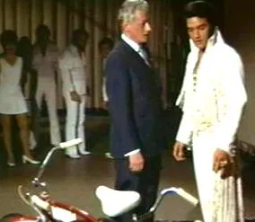 Elvis Presley performing on stage in the original Denis Sanders' 'Elvis: That's The Way It Is' film, highlighting the visual approach of the 1970 documentary.