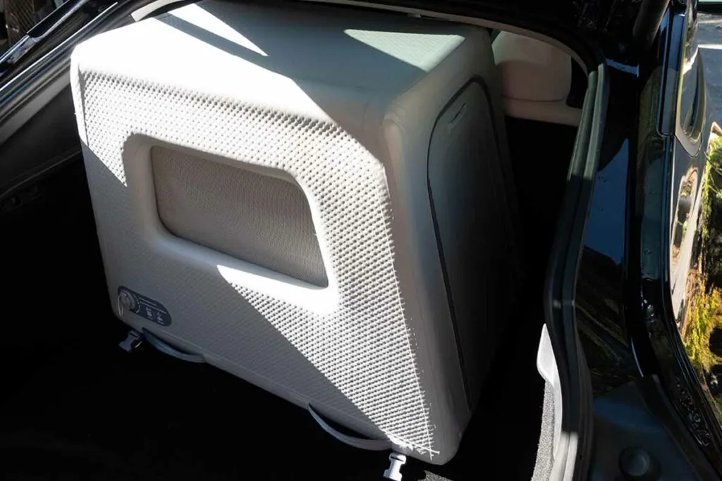 Enventur inflatable dog crate (34-inch size) fitted in a Tesla Model Y, showcasing a convenient option for car travel.