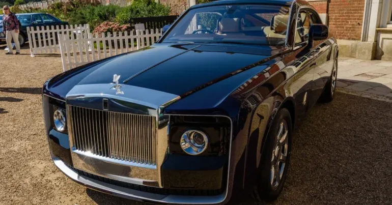 Expensive Rolls-Royce Sweptail with its unique panoramic glass roof and a design influenced by luxury yachts and classic Rolls-Royce aesthetics.