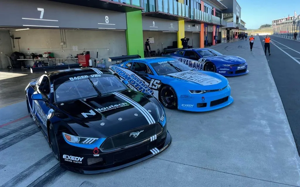 Ford Mustang and Chevrolet Camaro TA2 cars racing at Hampton Downs