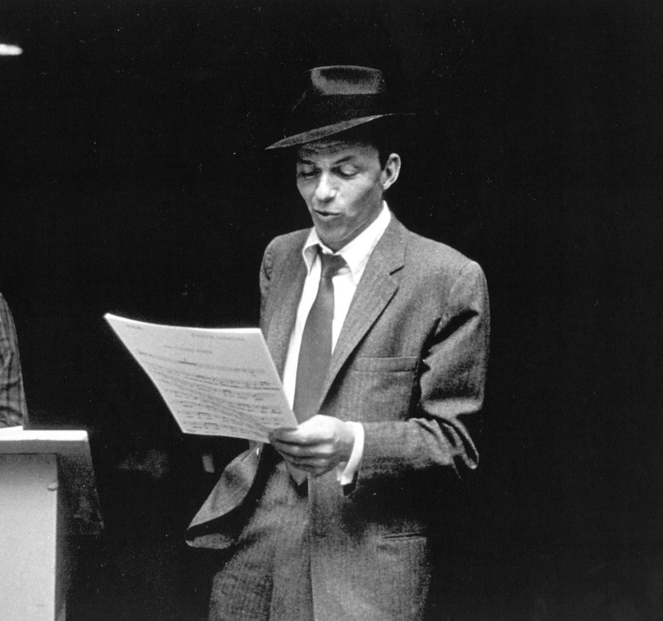 Frank Sinatra reviewing sheet music, connected to My Way's influence